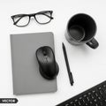 A pair of black framed glasses a black wireless mouse on a gray Royalty Free Stock Photo