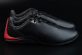 Pair of black leather motorsport shoes