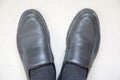 A pair of black leather shoes
