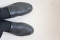 A pair of black leather shoes