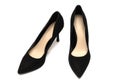 A pair of black pointed high-heeled shoes