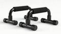 Pair of black push up bars with padded grips on white background Royalty Free Stock Photo