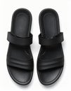 Pair of Black Rubber Sandals on a Clean White Background Top Down View Royalty Free Stock Photo