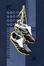 Pair of black and white soccer cleats, boots on blue background. Sport uniform part. Modern design.