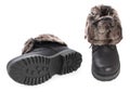 Pair of black winter fashion womens boots with fur isolated on a white background