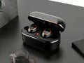 Pair of black wireless earbuds and charging case Royalty Free Stock Photo