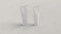 Pair of blank white tubes of toothpaste, cream or gel