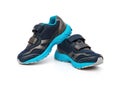 Pair of blue and black sporty shoes for kid on white Royalty Free Stock Photo