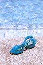 Pair of blue goggles by the pool Royalty Free Stock Photo