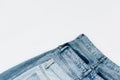 pair of blue jeans isolated on white with copy space, top view. Royalty Free Stock Photo