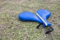 A pair of blue kick pads on the ground. Used for taekwondo or karate practice