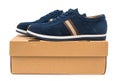 Pair of blue leisure shoes for man on a box on white Royalty Free Stock Photo