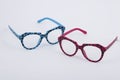 Pair of blue and pink plastic eyeglasses with spotted design