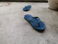 A pair of blue rubber slippers. Royalty Free Stock Photo