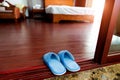 Pair of blue slippers on floor