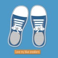 A pair of blue sneakers on blue background