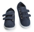 Pair of blue sporty sneakers, gumshoes for boy isolated on a white background, close up