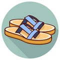 Pair of blue strap sandals with tan soles and long shadow Royalty Free Stock Photo