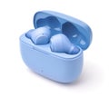 Pair of blue true wireless earbuds in charging case Royalty Free Stock Photo