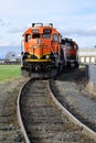 Pair of BNSF locomotives waiting work in local siding with curved track Royalty Free Stock Photo