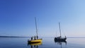 Pair of boats sailing on calm water in Thunder Bay, Canada