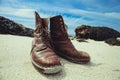Pair of boots on the beach Royalty Free Stock Photo