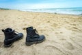 Pair of boots at beach Royalty Free Stock Photo