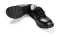 Pair of brand new black leather shoe for children on white Royalty Free Stock Photo