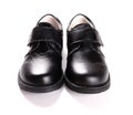 Pair of brand new black leather shoe for children on white Royalty Free Stock Photo