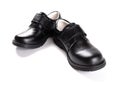 Pair of brand new black leather shoe for children on white