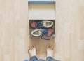 pair of brand new shoes in shoe cartoon box on wooden floor f Royalty Free Stock Photo