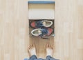 Pair of brand new shoes in shoe cartoon box on wooden floor f Royalty Free Stock Photo