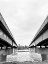 Pair of bridges crossing river leading into city Royalty Free Stock Photo