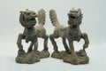 A pair of bronze Chinese Qilin figurines, shown here with 2 horns each and Chinese dragon-like features
