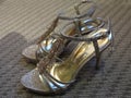 A pair of bronze gold coloured design ladies high heels shoes