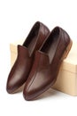 Pair of brown male shoes in front of show box Royalty Free Stock Photo