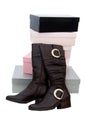 Pair of brown winter woman boots and many boxes