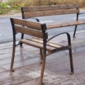 A pair of brown wooden benches