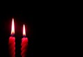 Pair of Burning Red Candles On the Dark Background Royalty Free Stock Photo