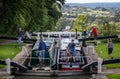 Pair of Canal Boats in a lock at the top of the Caen Hill flight of locks on the Kennet & Avon Canal in Devizes, Wiltshire, UK