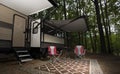 Pair of chairs at a campter trailer campsite