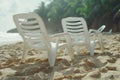 A pair of chairs summer tropical beach lapis ocean shore white sand vacation sunbathing island nature holiday clear sky Royalty Free Stock Photo