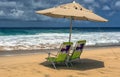 A pair of chairs, waiting for customers, at the Cacimba do Padre Beach, in Fernando de Noronha, Brazil