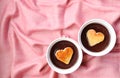 Pair of Chocolate Mousse Pastries with Heart Shaped Chiffon Cakes on Pink Cloth Royalty Free Stock Photo