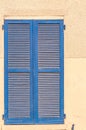 Pair of, close, blue, tall, wood shutters, on 1500\'s building