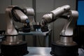 pair of cobots working side by side to fabricate parts