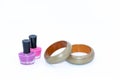 Nail polish bottles and green wooden bangles Royalty Free Stock Photo