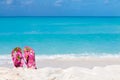 Pair of colored sandals on a white sand beach Royalty Free Stock Photo