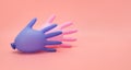 A pair of colorful surgical inflated gloves on a pink background. Protection and prevention against coronavirus, covid-19