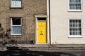 Pair of colourful doors seen on the entrances to old-style terraced houses. Royalty Free Stock Photo